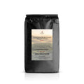 Black coffee bag with Santos Heritage Selection label on a white background
